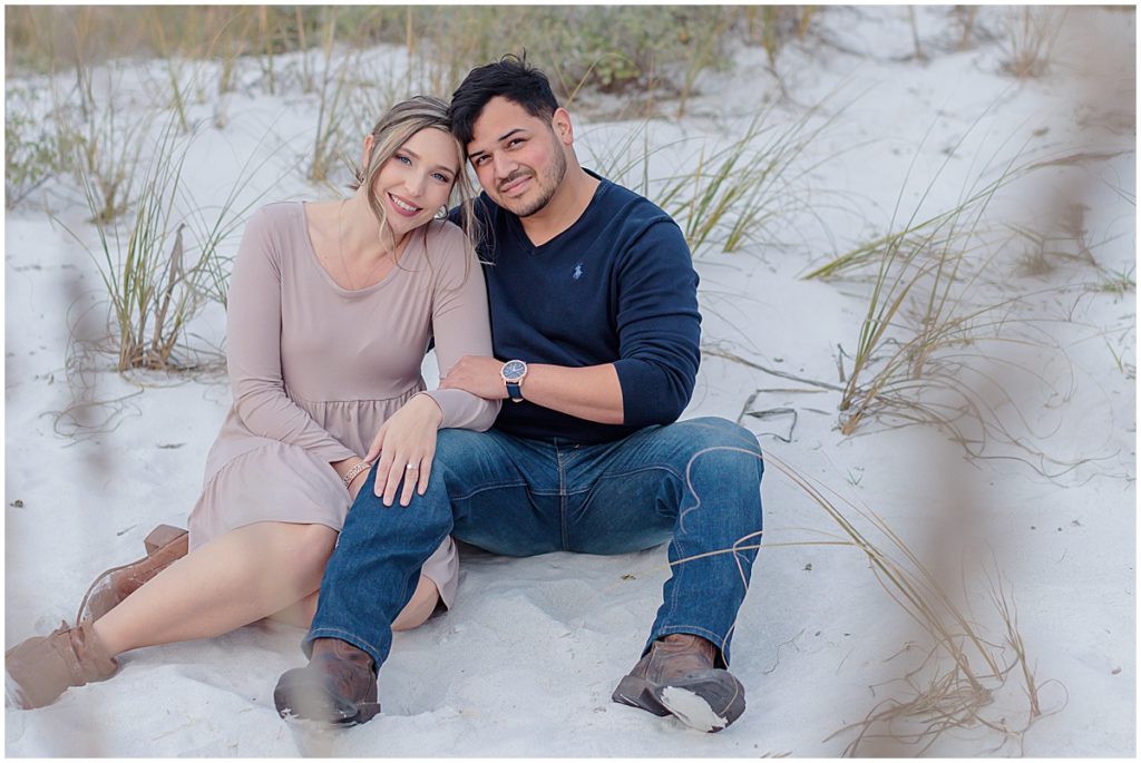 couple sitting in sand