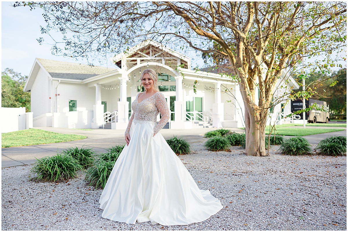 bride outside white chapel and harbor hall